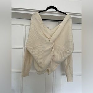 Cream knit off the shoulder sweater with twist back